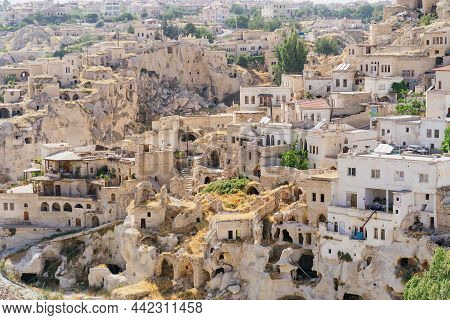 Cappadocia, Turkey - 20 July 2021. Day View Of Goreme Town With Blue Clear Sky On Horison. Famous Ce