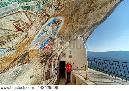 Montenegrin Monastery Terrace ,carved Into The Face Of Ostroška Greda Mountain.