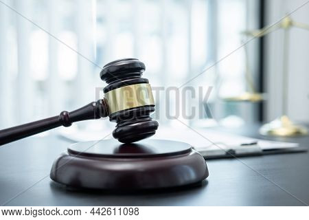Judge Gavel With Justice At Law Firm In Background With Legal Case Document Contract, Law And Justic