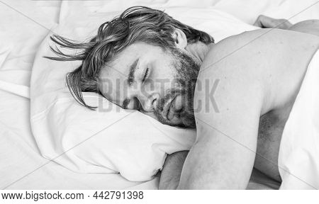 How Much Sleep You Actually Need. Man Handsome Guy Lay In Bed. Get Adequate And Consistent Amount Of
