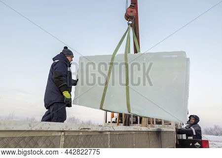 Installers Unloading Ice Blocks For An Ice Town