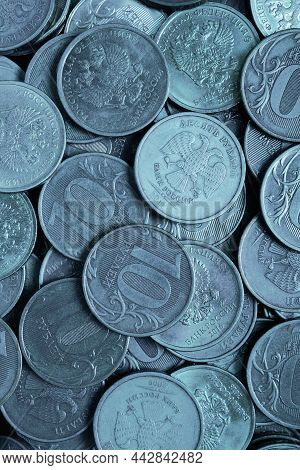 A Surface Of Russian Coins Of 10 Rubles. Blue Tinted Vertical Background. Economy And The Central Ba