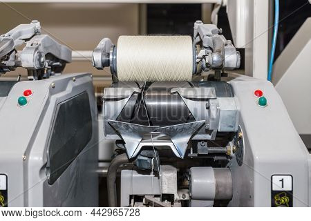 Cotton Yarn Production In A Textile Factory. Textile Fabric Manufacturing Machines In Work. Row Of A