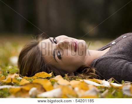 Woman relaxing in a beautiful day of autumn