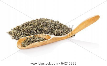 Fragrant green tea and wooden spoon