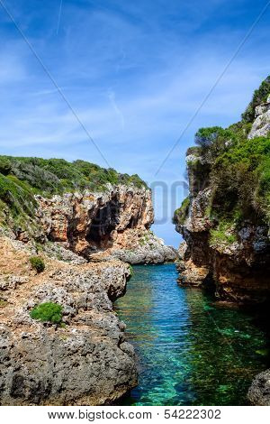 Cala de Rafalet cove in sunny day, Menorca island, Spain