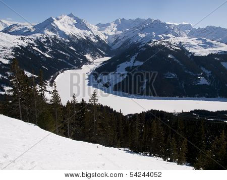 Frozen Lake In The Alps