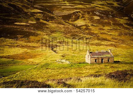 Little abandoned stone house in a middle of a mountain in the Cairngorms, Scotland, UK.
