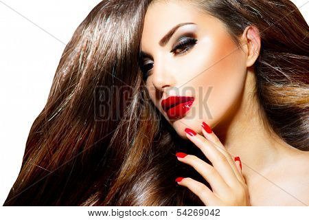 Sexy Beauty Girl with Red Lips and Nails. Provocative Make up. Luxury Woman with Long Brown Smooth Hair. Fashion Brunette Portrait isolated on a white background. Gorgeous Woman Face. 