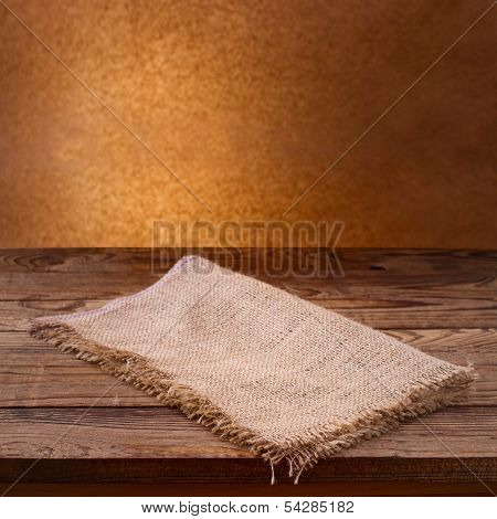Empty wooden deck table with tablecloth