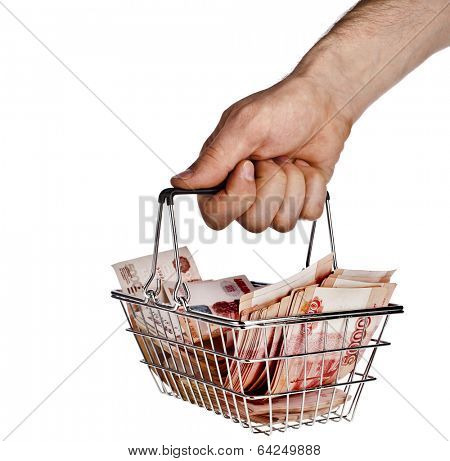 Man's hand holding a Money Rubles of the Russian Federationin your shopping  basket cart  isolated on white background 