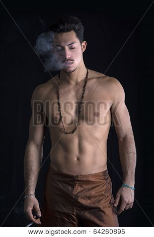 Athletic Shirtless Young Man With Mustache Smoking