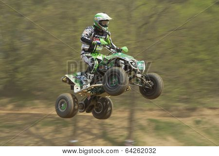 Quad Racerin Green Is Jumping