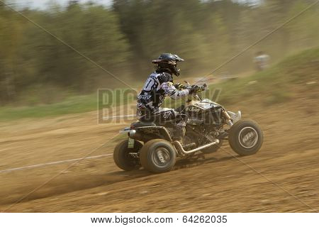 Dynamic Shot Of Quad Racer Riding