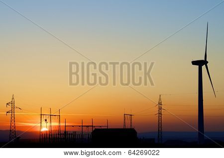 silhouette of a alectrical substation and windmill, La Muela, Zaragoza, Aragon, Spain