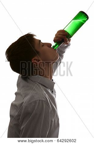 Young Man Drinks A Beer