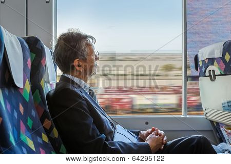 Japanese Businessman on a Train