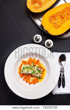 Seafood With Pumpkin Garnish. White Diet  Fish With Pumpkin And Vegetables. Studio Shot.