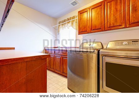 Laundry Room With Modern Steel Appliances