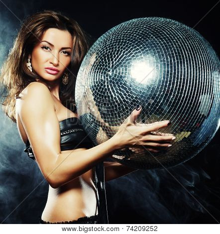 girl in smoke with disco ball