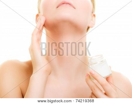 Skin Care. Girl Applying Moisturizing Cream