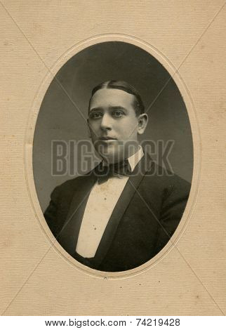 USA- CIRCA 1910s: Vintage photo shows portert of young businessman. 