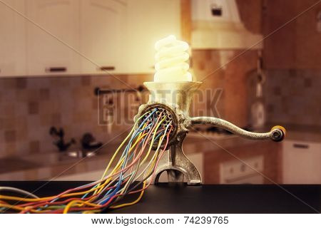 Mincing machine is grinding up a lamp
