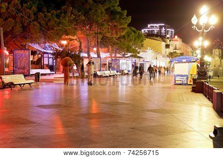 People Walking On Promenade In Yalta City In Night