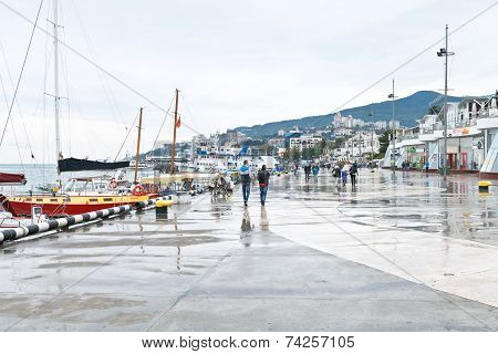 Tourists On Embankment In Yalta City In Rainy Day