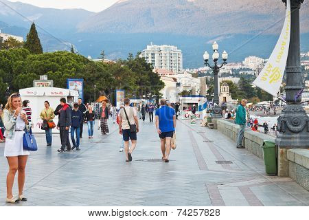 Tourists On Lenin Embankment In Yalta In Evening