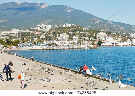 Tourist On Waterfront Of Yalta City In Crimea