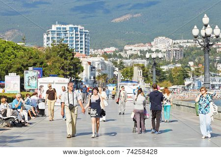 Tourists Walk On Promenade In Yalta In September