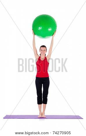 Young woman exercising with swiss ball
