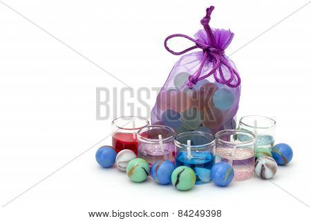 Bag With Stones And Candles On A White Background On The Right