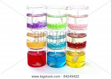 Candles In Glass In A Row On Top Of Each Other On A White Background