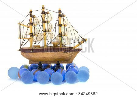 Wooden Toy Ship At Sea On A White Background