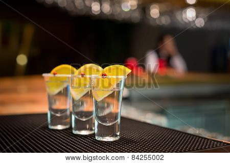 Three Tequila Shots With Lemon