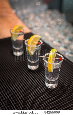 Three Tequila Shots With Lemon