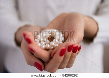 Pearls In Female Hands