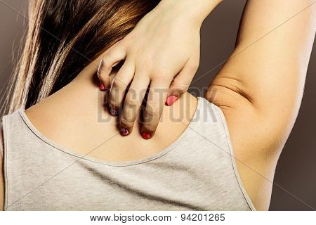 Woman Scratching Her Back Closeup