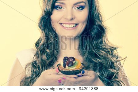 Smiling Cute Woman Holds Fruit Cake In Hand
