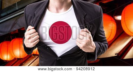 Businessman stretching suit with Japanese Flag with red lamp on background