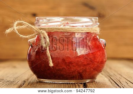 Homemade Strawberry Jam In Glass Jar With Hempstring On Paper Napkin