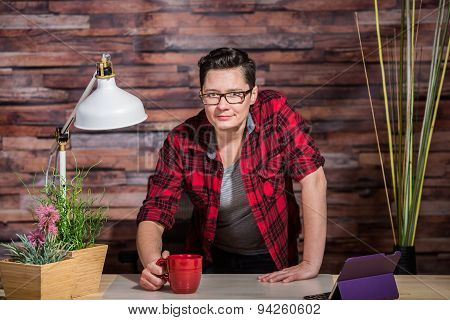 Woman Standing Behind Desk