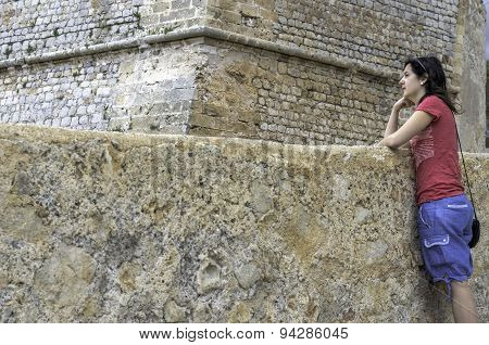 Girl Standing In Stone Wall, Ancient City.