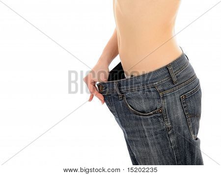 Slim donna In pantaloni oversize grande ha perso il suo peso. Isolated On White Background