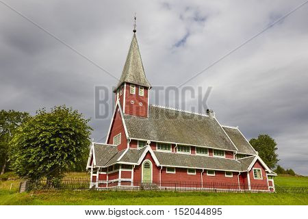 Traditional norwegian red stave church. Rodven. Travel Norway. Horizontal