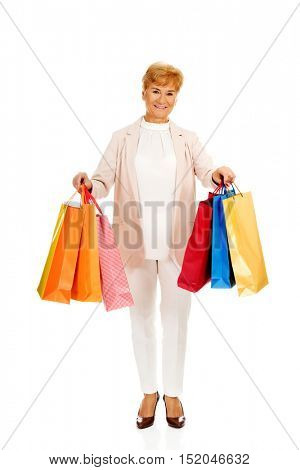 Happy business woman holging shopping bags