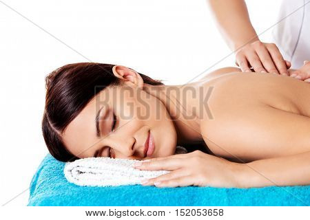 Woman having massage of body in the spa salon. Beauty treatment concept.