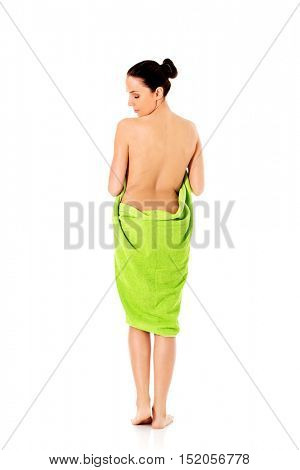 Young beautiful woman after bath full portrait isolated over white.